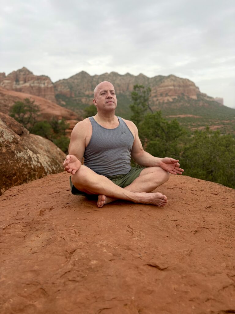 strong man in crosslegged seated position meditating