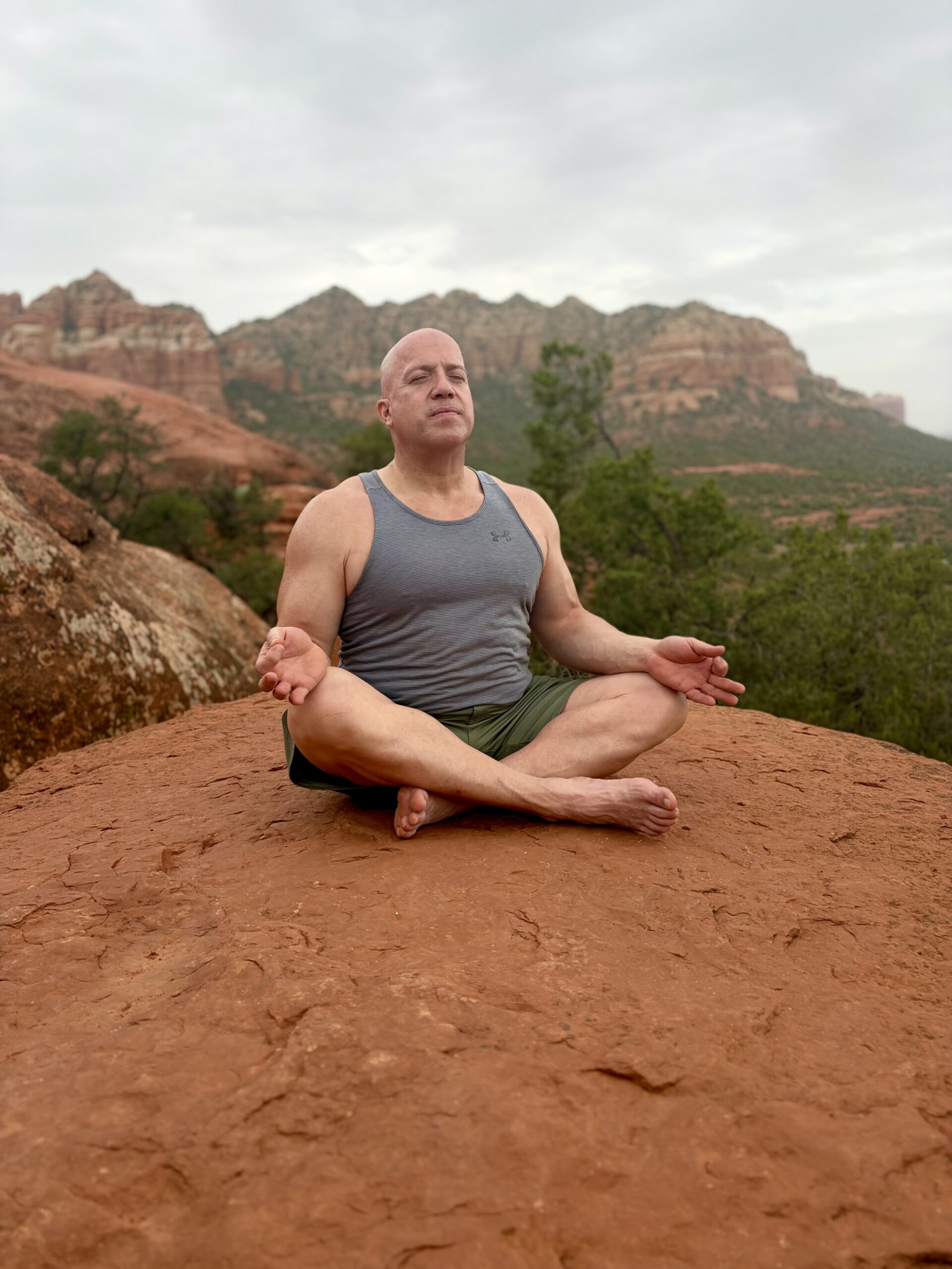 strong man in crosslegged seated position meditating